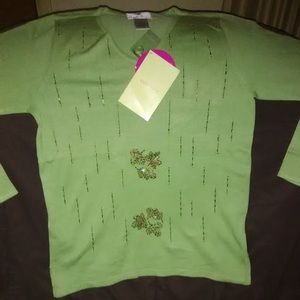 Green sweater with bead designs